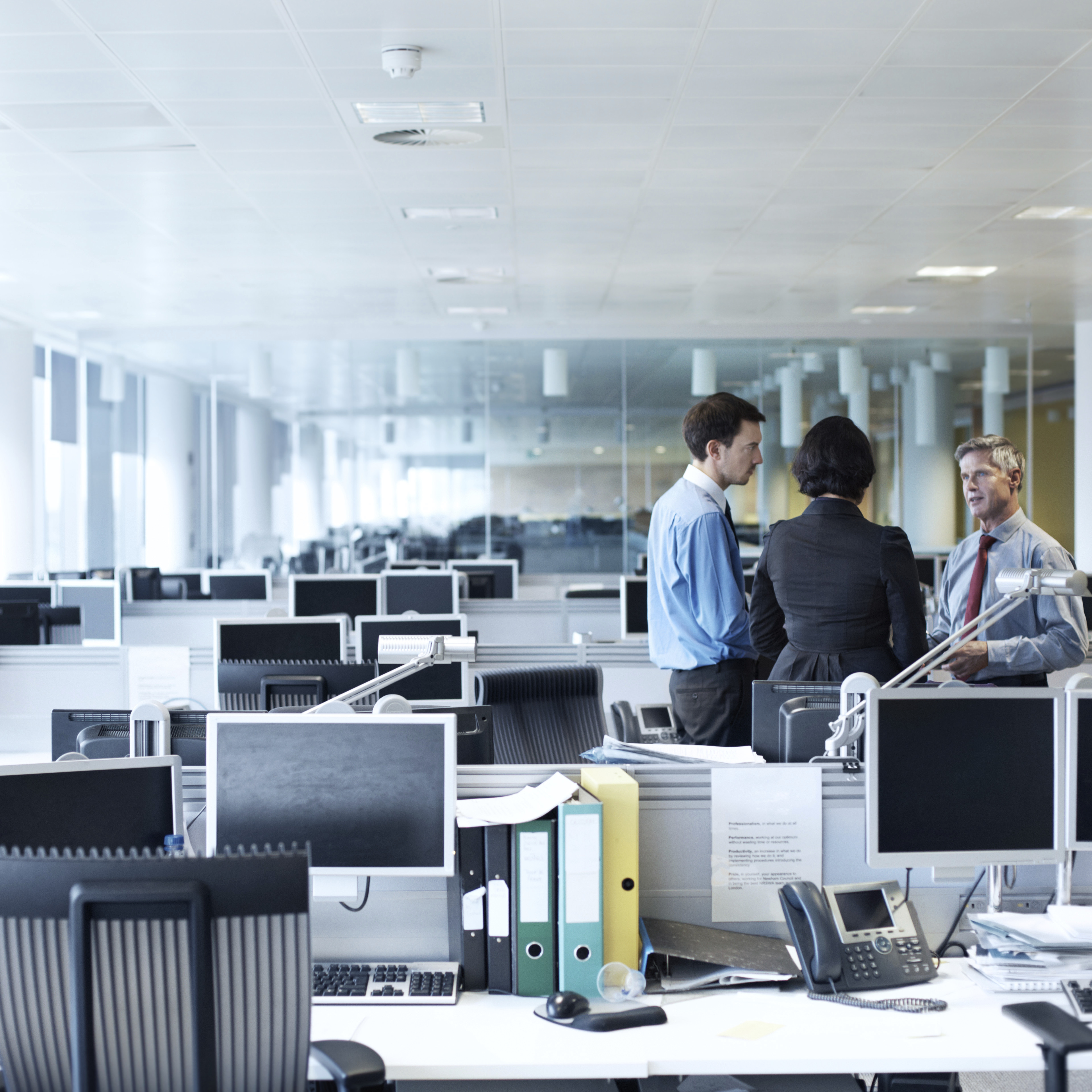 Golden words of encouragement Shot of three businesspeople discussing something in the office